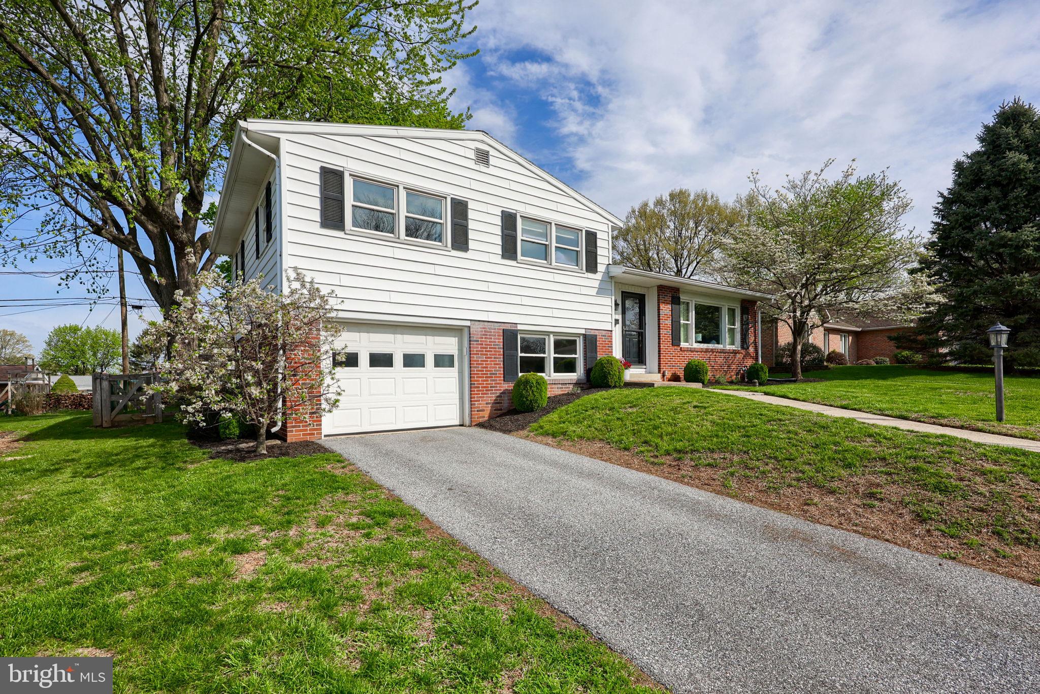 67 Oberlin Avenue Reading, PA 19608 - Photo 2 of 25 a front view of house with yard and green space