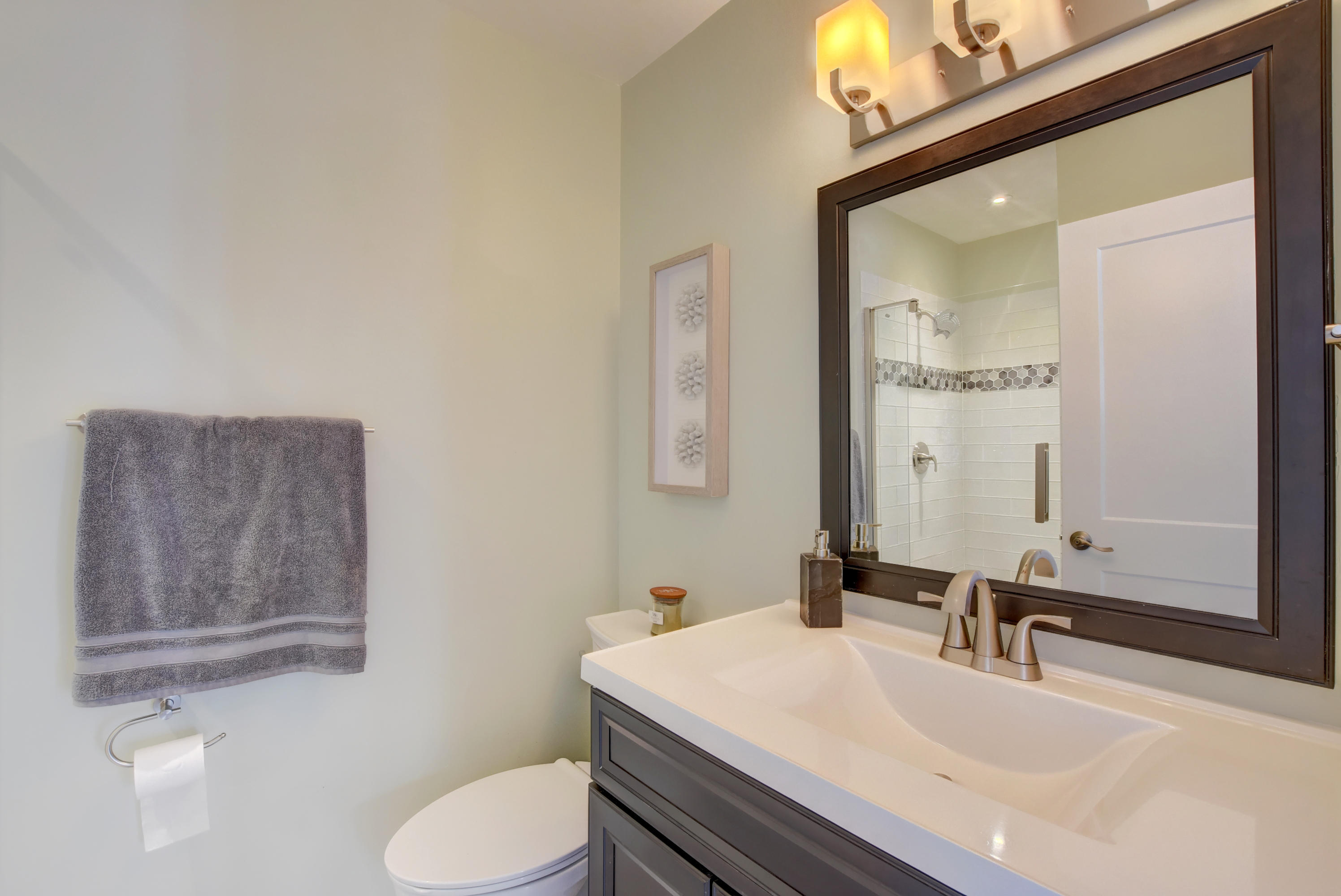 7445 Texas Trail Boca Raton, FL 33487 - Photo 19 of 28 a bathroom with a sink vanity mirror and toilet