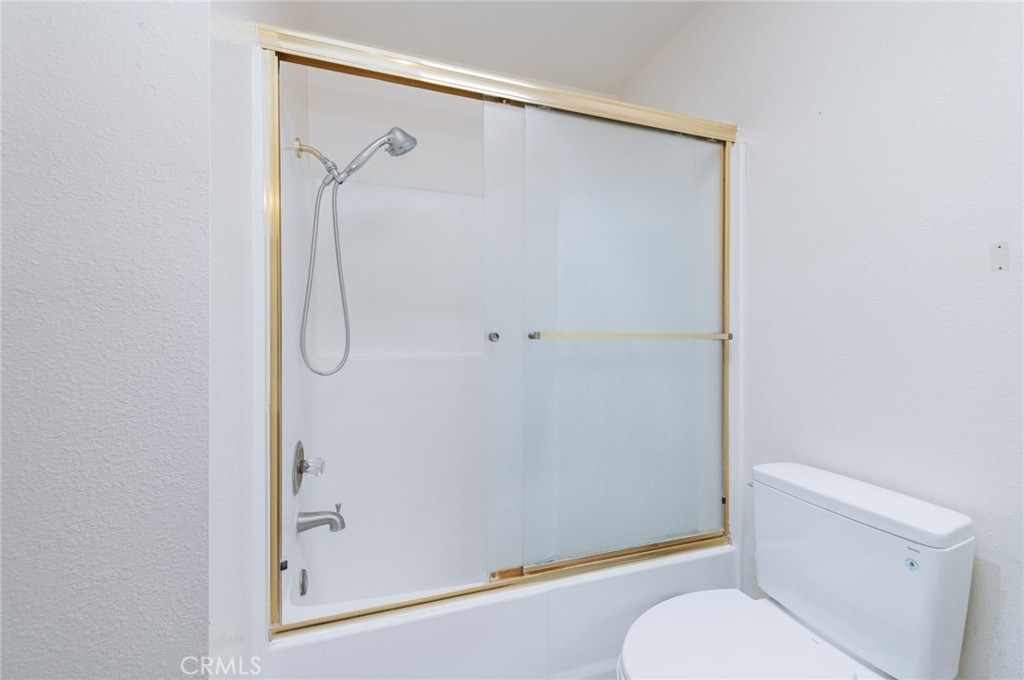 232 West Mission Road, Unit C San Gabriel, CA 91776 - Photo 11 of 11 a bathroom with a granite countertop toilet and a shower