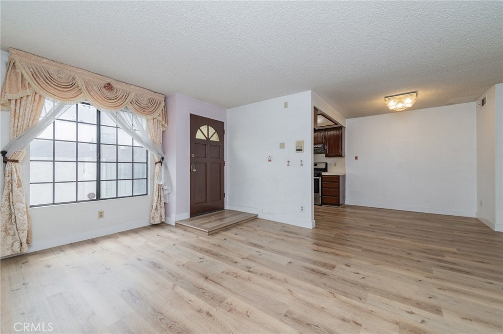 232 West Mission Road, Unit C San Gabriel, CA 91776 - Photo 3 of 11 wooden floor in an empty room with a window