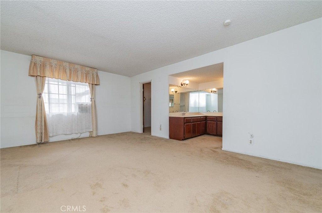 232 West Mission Road, Unit C San Gabriel, CA 91776 - Photo 8 of 11 an empty room with windows