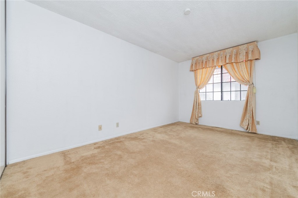 232 West Mission Road, Unit C San Gabriel, CA 91776 - Photo 10 of 11 an empty room with windows