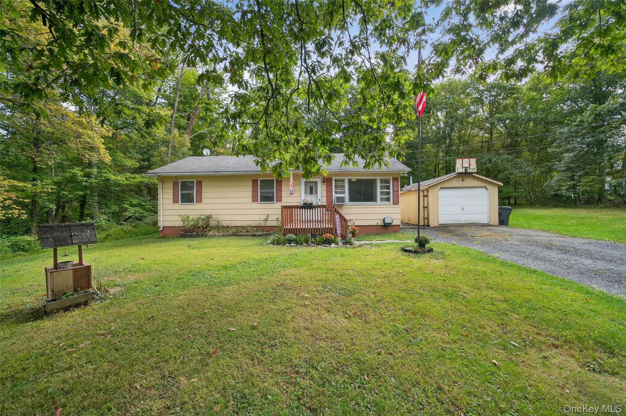 68 Quannacut Road Pine Bush, NY 12566 - Photo 1 of 1 Ranch-style home with an outdoor structure, a front yard, a garage, and driveway