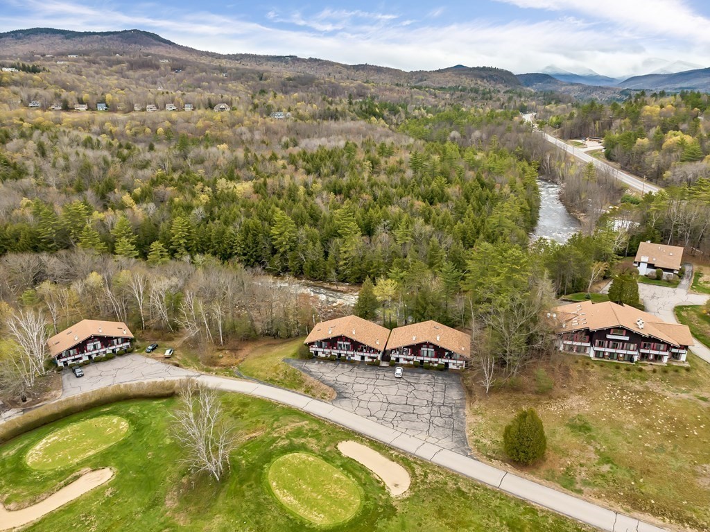 34 Linderhof Golf Course Road, Unit C12 Glen, NH 03838 - Photo 16 of 37 a view of a lake with a mountain