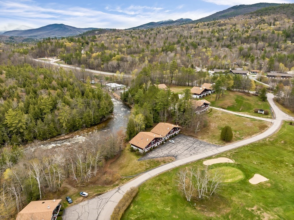34 Linderhof Golf Course Road, Unit C12 Glen, NH 03838 - Photo 17 of 37 a view of a swimming pool with a yard