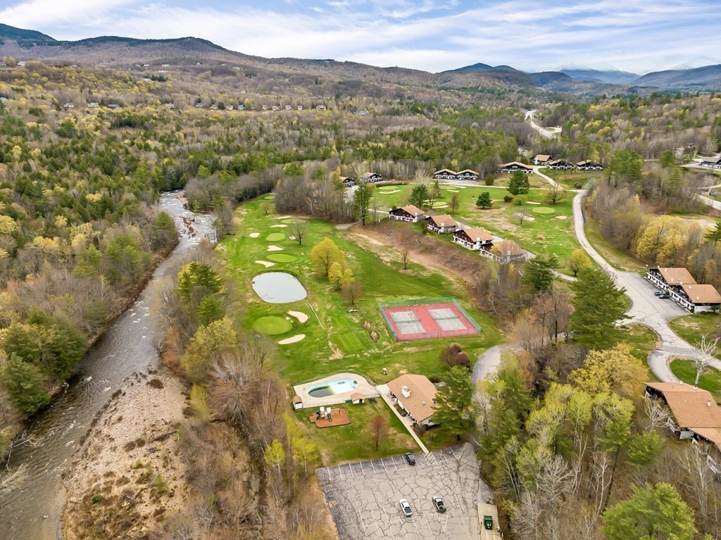 34 Linderhof Golf Course Road, Unit C12 Glen, NH 03838 - Photo 2 of 37 a view of a city with mountains in the background