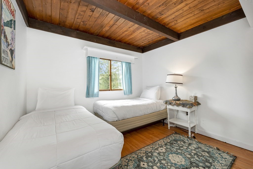 34 Linderhof Golf Course Road, Unit C12 Glen, NH 03838 - Photo 21 of 37 a bedroom with bed and a window