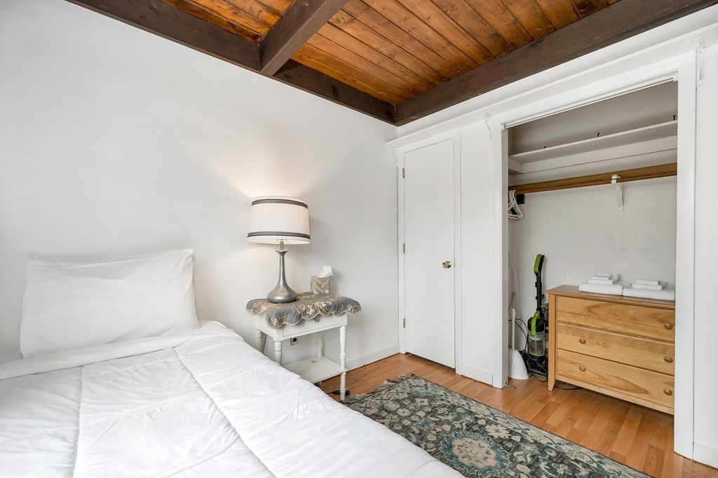 34 Linderhof Golf Course Road, Unit C12 Glen, NH 03838 - Photo 22 of 37 a bedroom with a bed and a closet