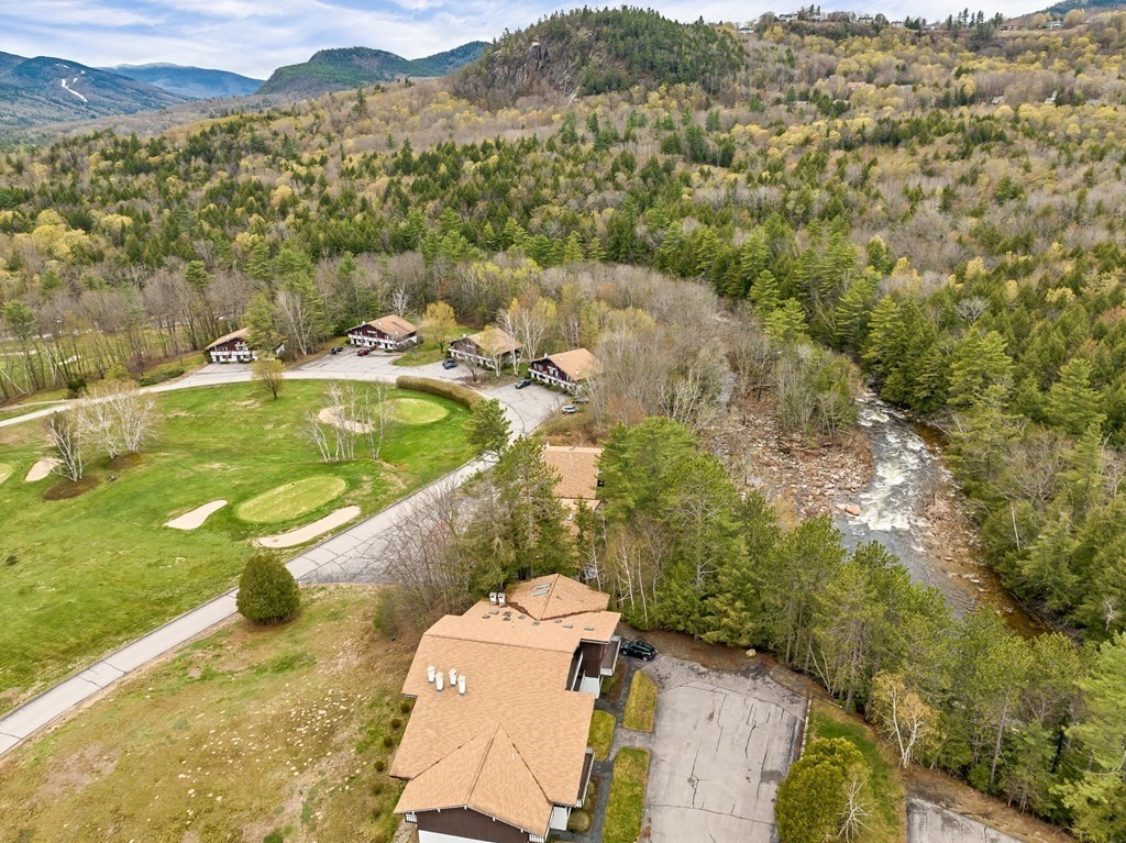 34 Linderhof Golf Course Road, Unit C12 Glen, NH 03838 - Photo 30 of 37 a view of a swimming pool with a yard