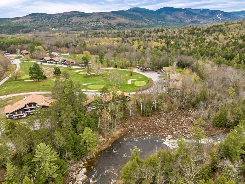 34 Linderhof Golf Course Road, Unit C12 Glen, NH 03838 - Photo 3 of 37 a view of lake with mountain