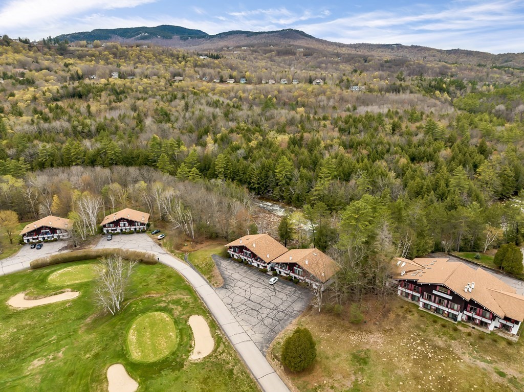 34 Linderhof Golf Course Road, Unit C12 Glen, NH 03838 - Photo 33 of 37 a view of a swimming pool with a mountain view