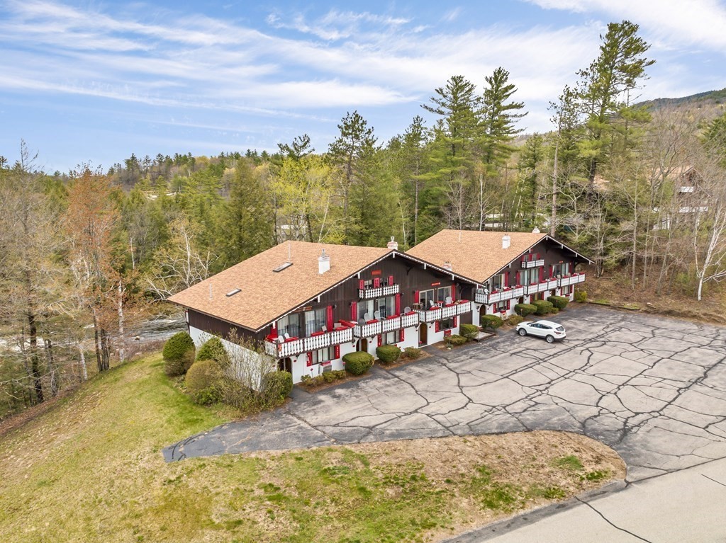 34 Linderhof Golf Course Road, Unit C12 Glen, NH 03838 - Photo 34 of 37 a view of a house with a yard