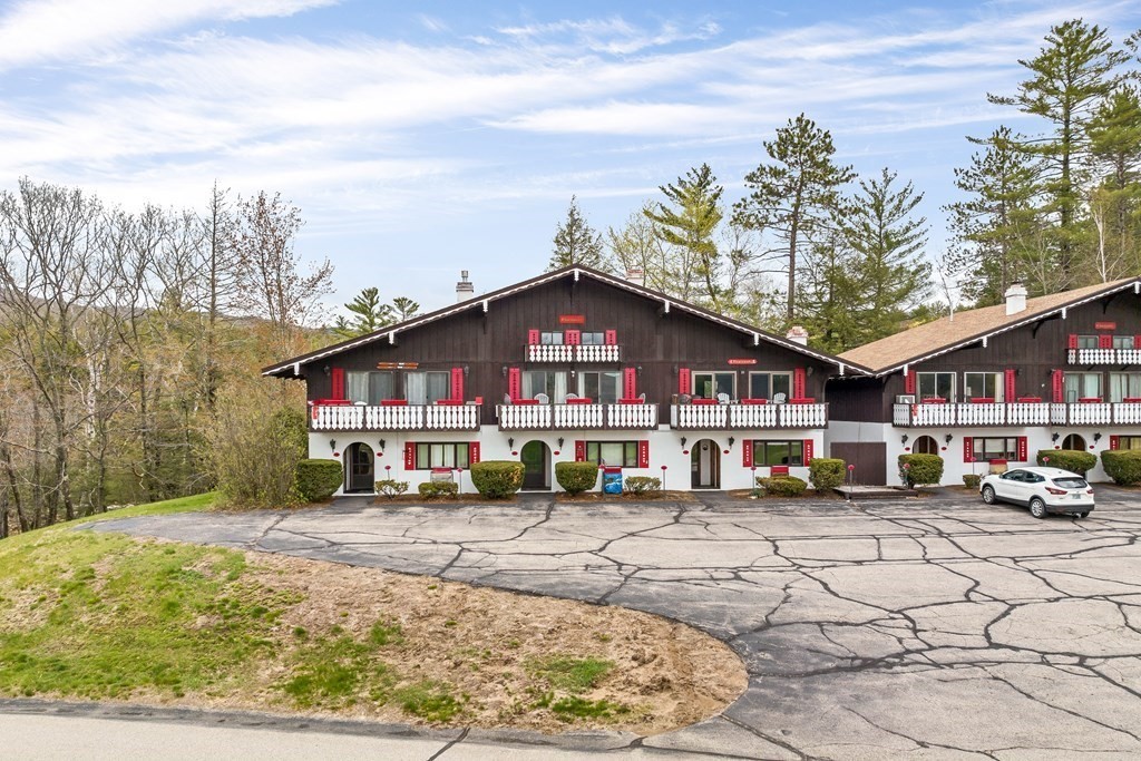 34 Linderhof Golf Course Road, Unit C12 Glen, NH 03838 - Photo 35 of 37 a front view of a building with garden