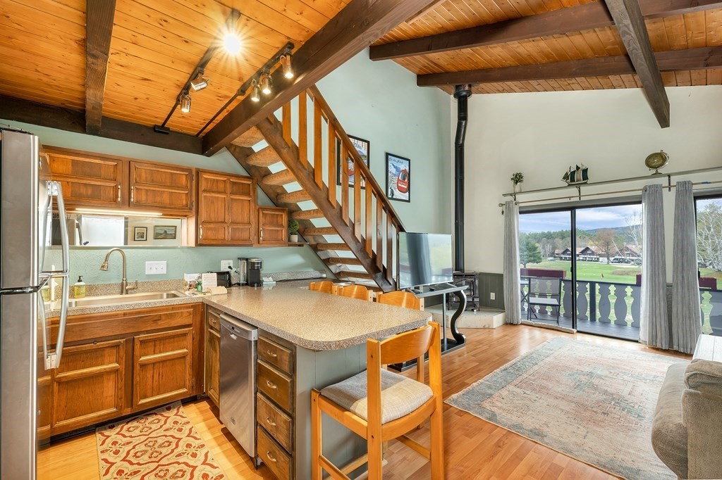 34 Linderhof Golf Course Road, Unit C12 Glen, NH 03838 - Photo 10 of 37 a very nice looking room with a large window