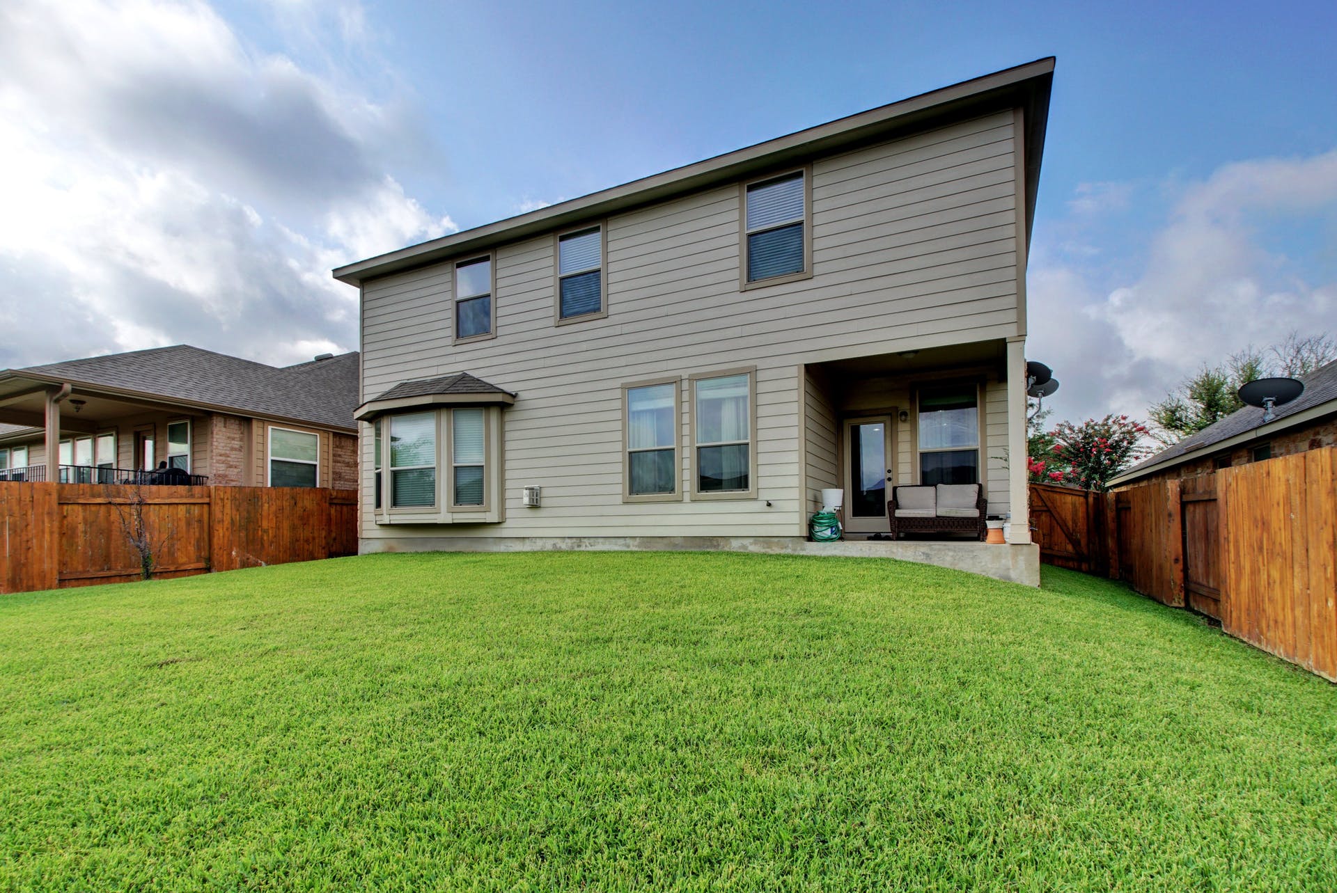 2004 Autumn Run Lane Round Rock, TX 78665 - Photo 25 of 37 A neatly maintained lawn provides a verdant backdrop to this two-story residence, featuring a covered patio and privacy fencing.
