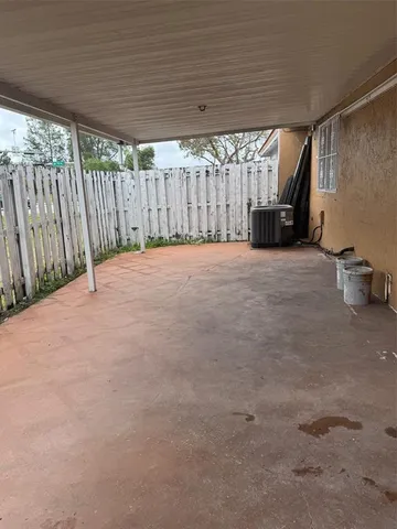 a view of an empty room with a sink