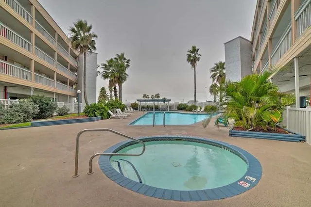 a view of a swimming pool with a patio