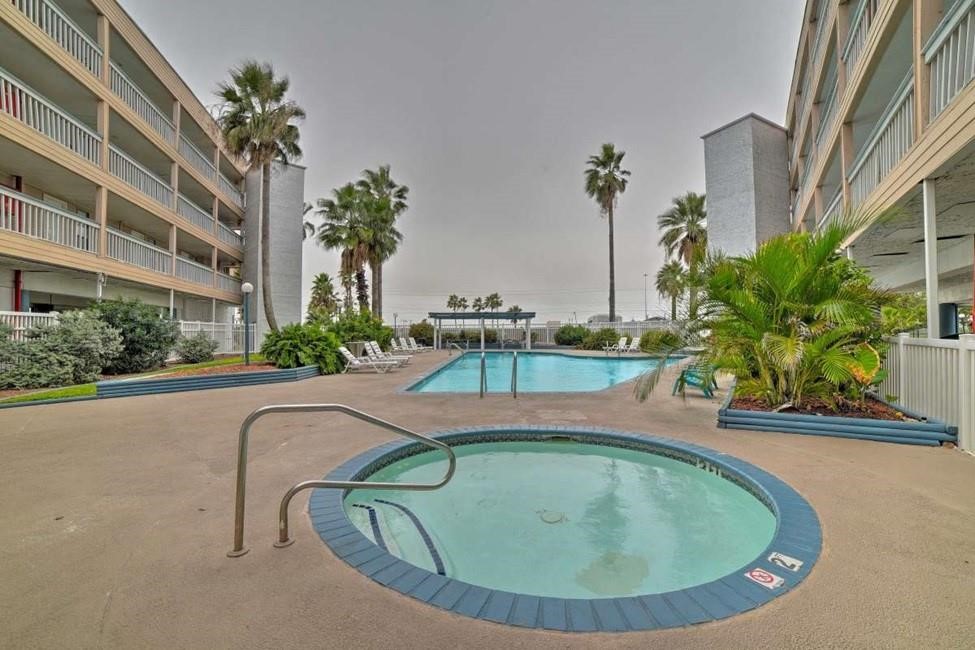 3938 Surfside Boulevard, Unit 3222 Corpus Christi, TX 78402 - Photo 3 of 9 a view of a swimming pool with a patio