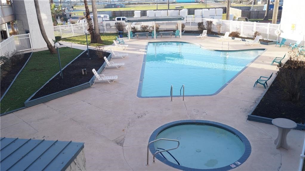 3938 Surfside Boulevard, Unit 3222 Corpus Christi, TX 78402 - Photo 5 of 9 an aerial view of a swimming pool