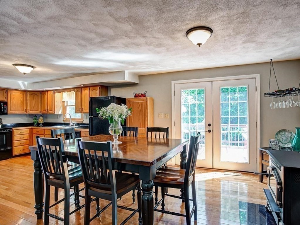 226 Allen Road Billerica, MA 01821 - Photo 12 of 25 a view of a dining room with furniture and a potted plant
