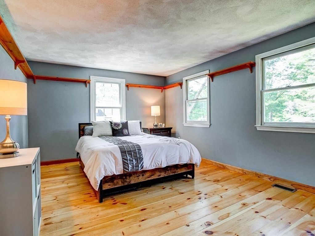 226 Allen Road Billerica, MA 01821 - Photo 14 of 25 a spacious bedroom with a bed and window
