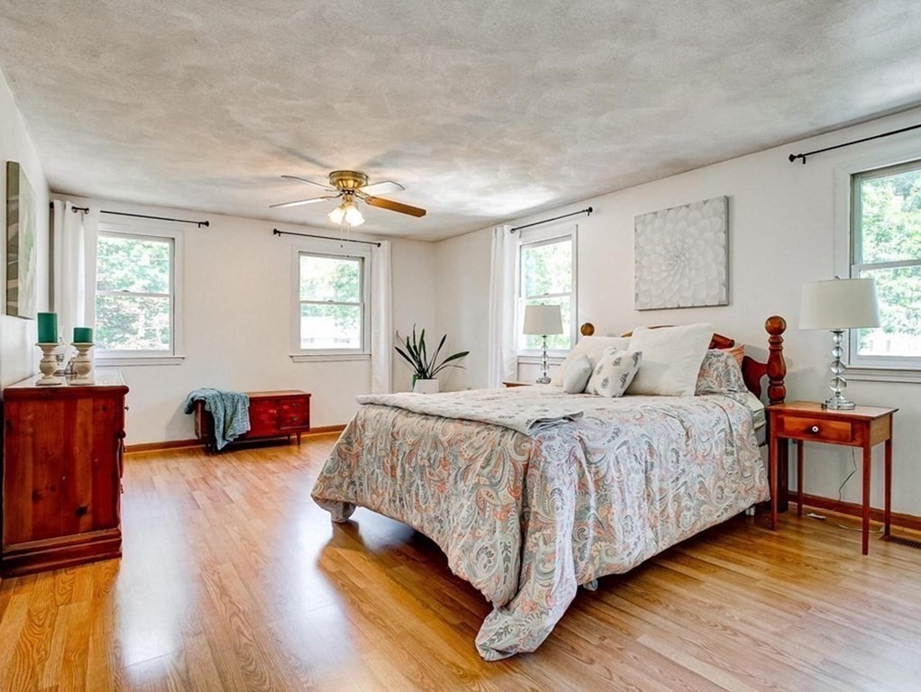 226 Allen Road Billerica, MA 01821 - Photo 19 of 25 a spacious bedroom with a bed and wooden furniture