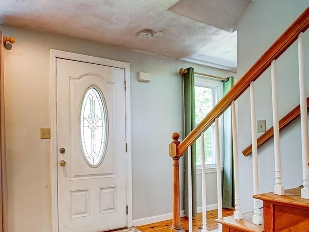 226 Allen Road Billerica, MA 01821 - Photo 4 of 25 a view of a hallway with wooden floor and entryway