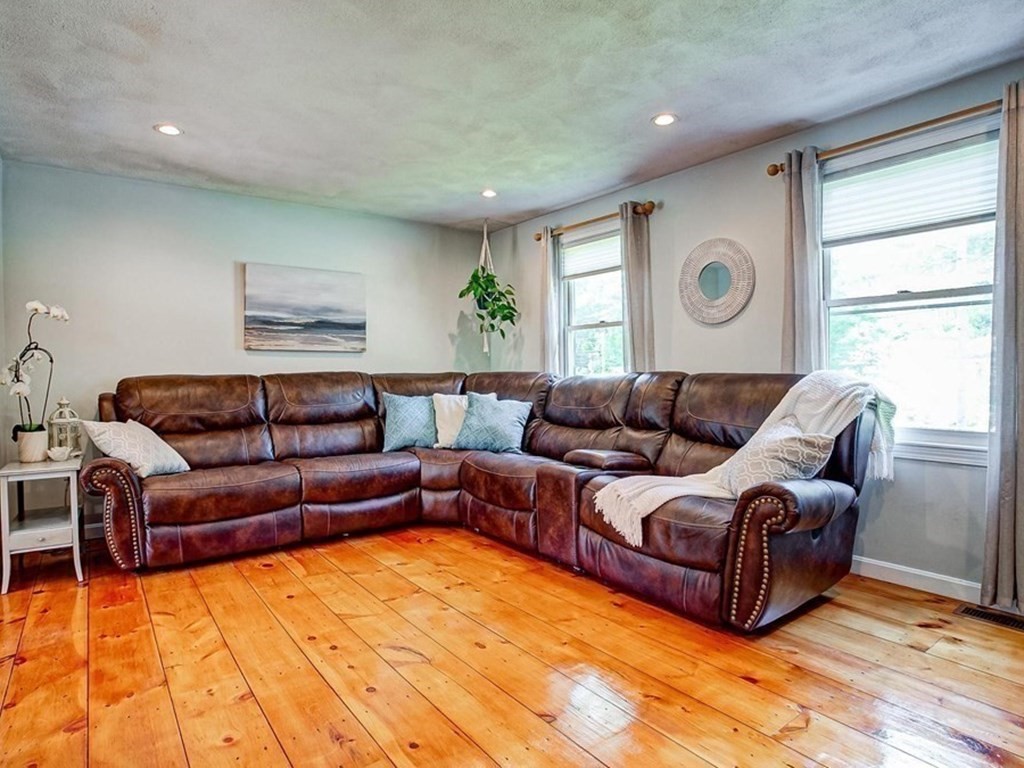 226 Allen Road Billerica, MA 01821 - Photo 5 of 25 a living room with a couch and dresser