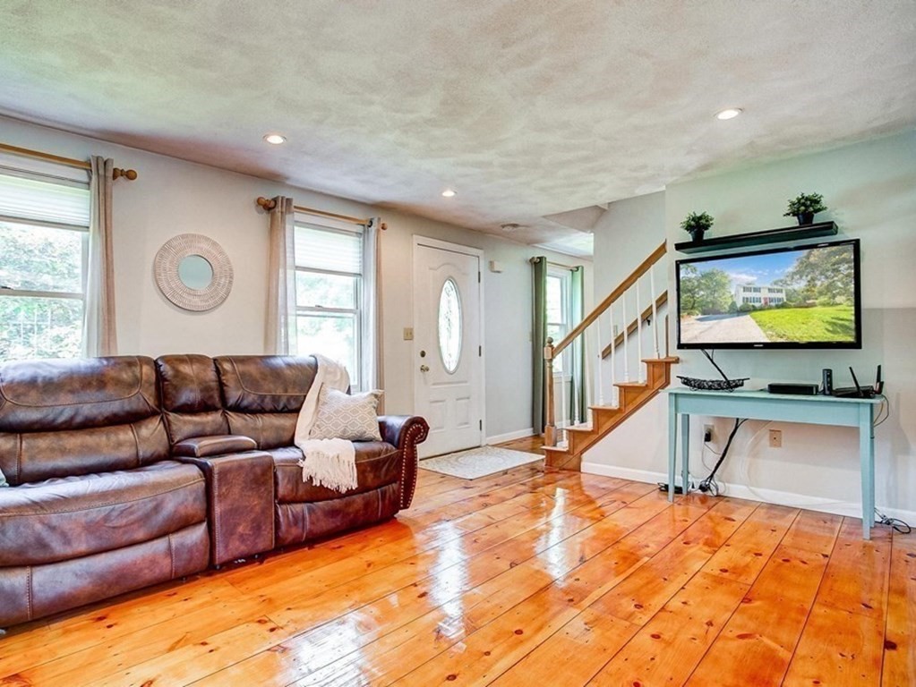 226 Allen Road Billerica, MA 01821 - Photo 6 of 25 a living room with furniture and a flat screen tv