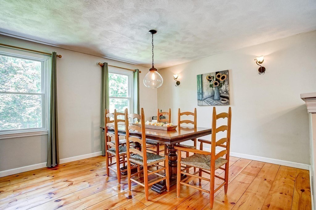 226 Allen Road Billerica, MA 01821 - Photo 8 of 25 a view of a dining room with furniture window and wooden floor