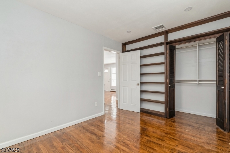 3 Castle Rock Road Lake Hopatcong, NJ 07849 - Photo 10 of 14 a view of empty room with wooden floor and window