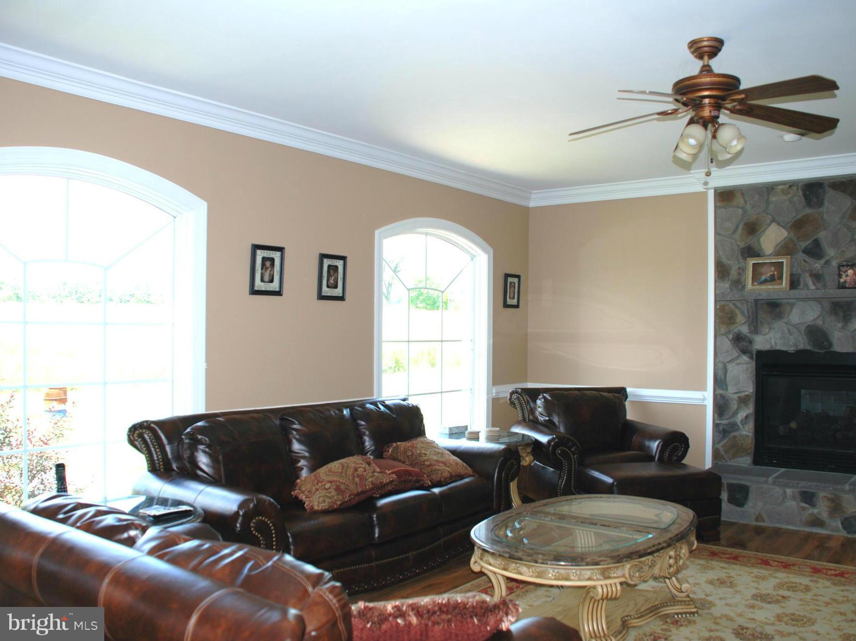 6015 Boston Ridge Court Boston, VA 22713 - Photo 12 of 30 a living room with furniture and a fireplace