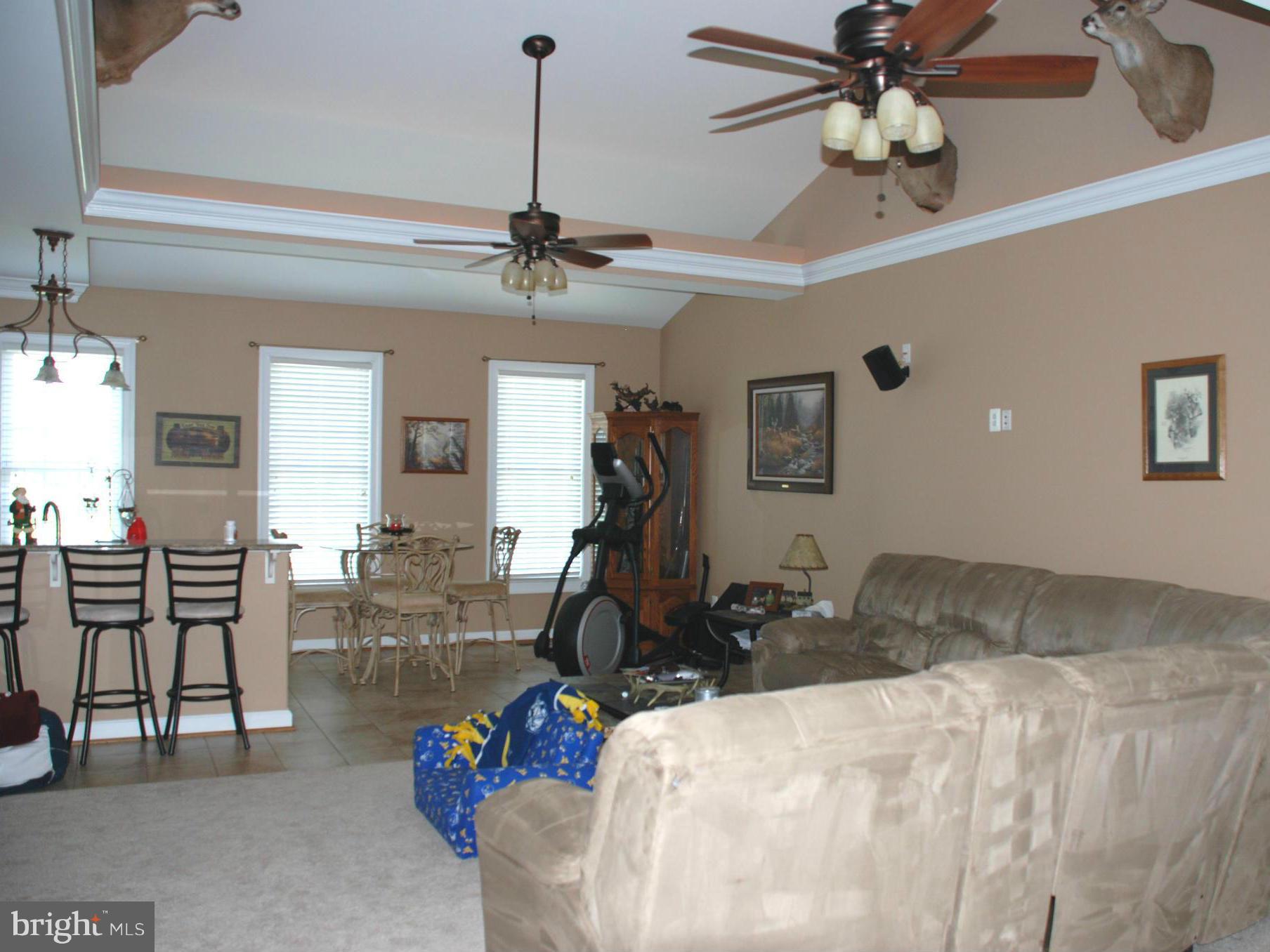 6015 Boston Ridge Court Boston, VA 22713 - Photo 13 of 30 a bedroom with furniture a ceiling fan and a wooden floor