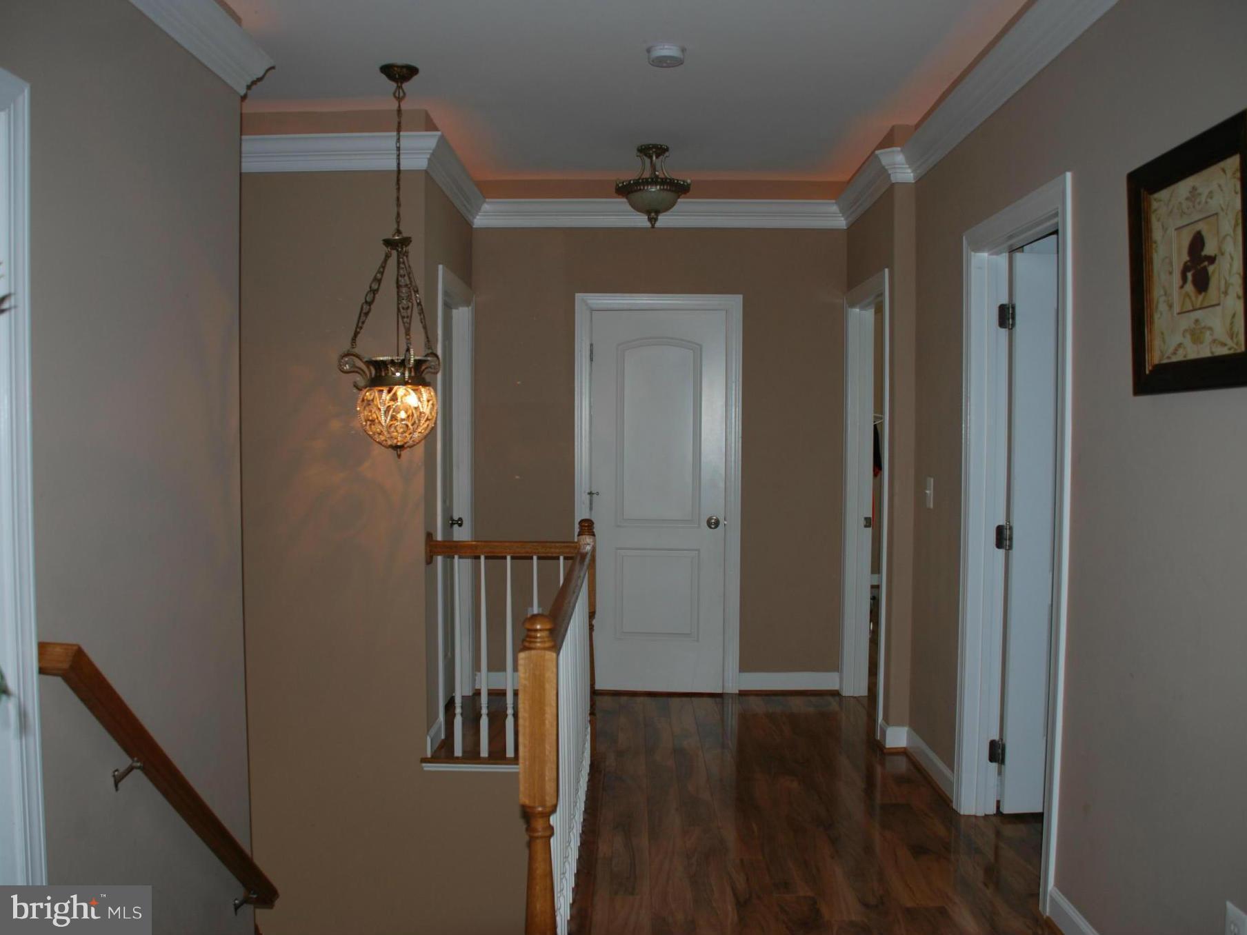 6015 Boston Ridge Court Boston, VA 22713 - Photo 19 of 30 a view of empty room with wooden floor and fan