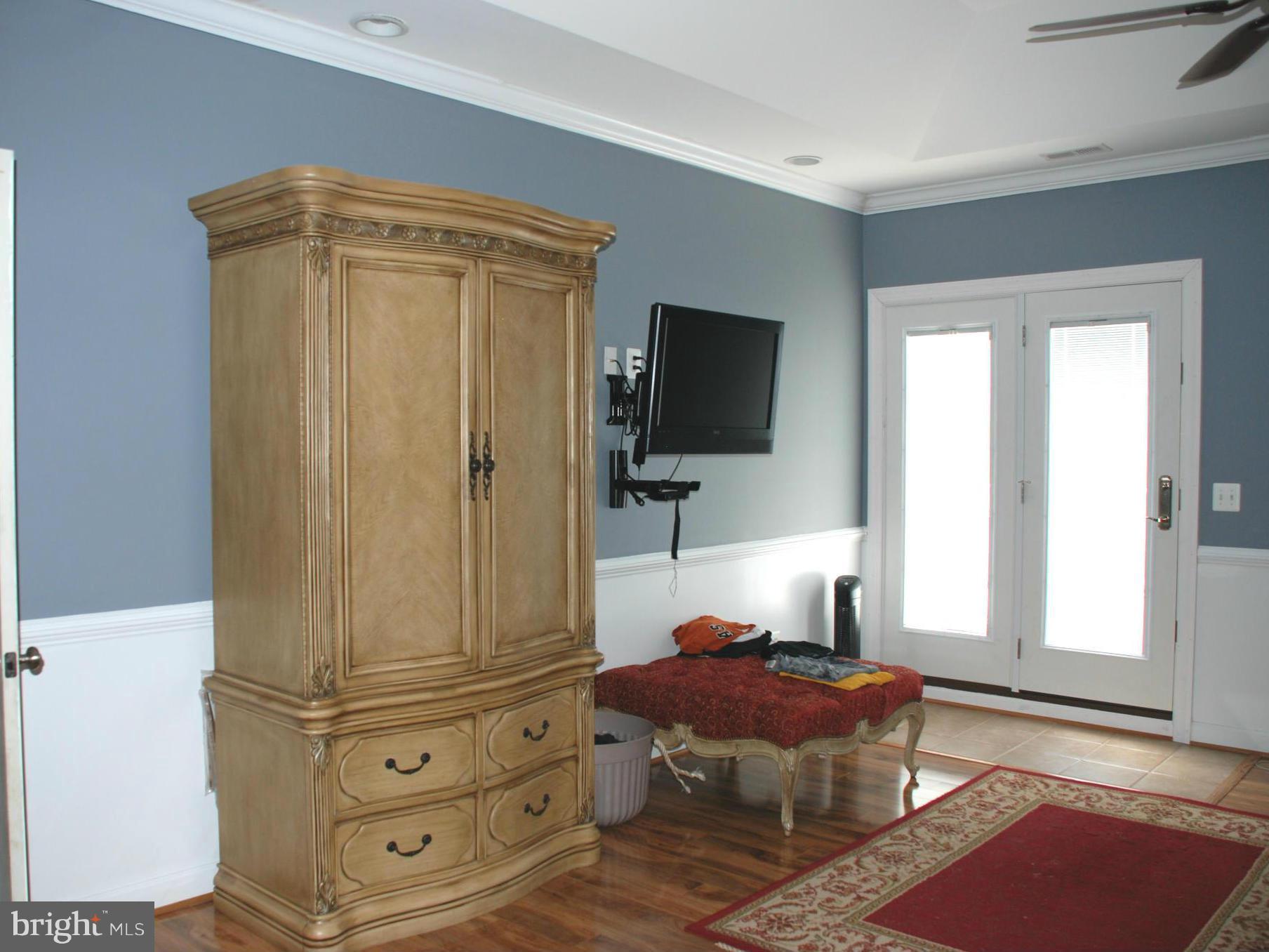 6015 Boston Ridge Court Boston, VA 22713 - Photo 22 of 30 a bedroom with a bed and flat screen tv