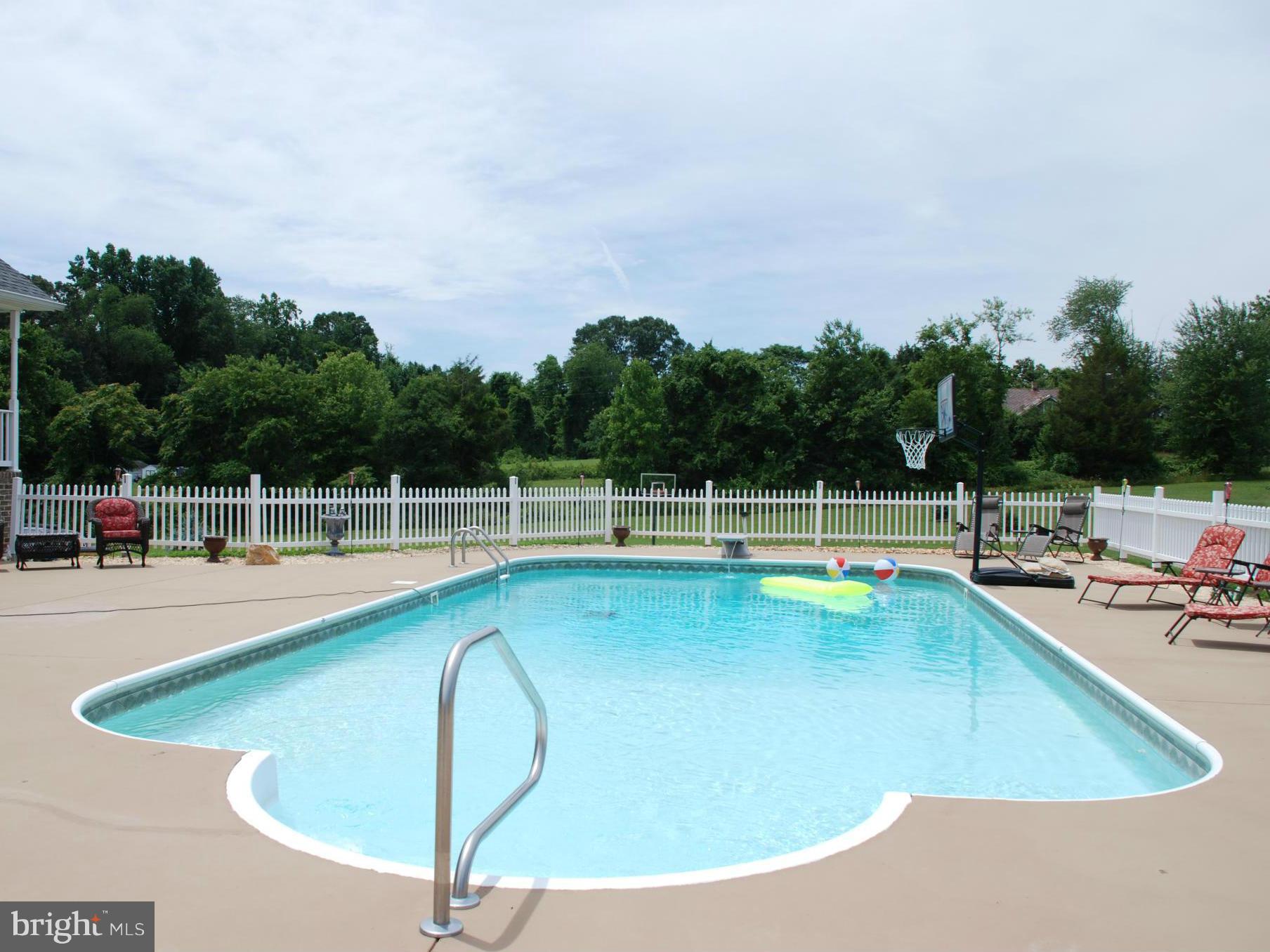 6015 Boston Ridge Court Boston, VA 22713 - Photo 27 of 30 a view of a swimming pool with a yard and sitting area