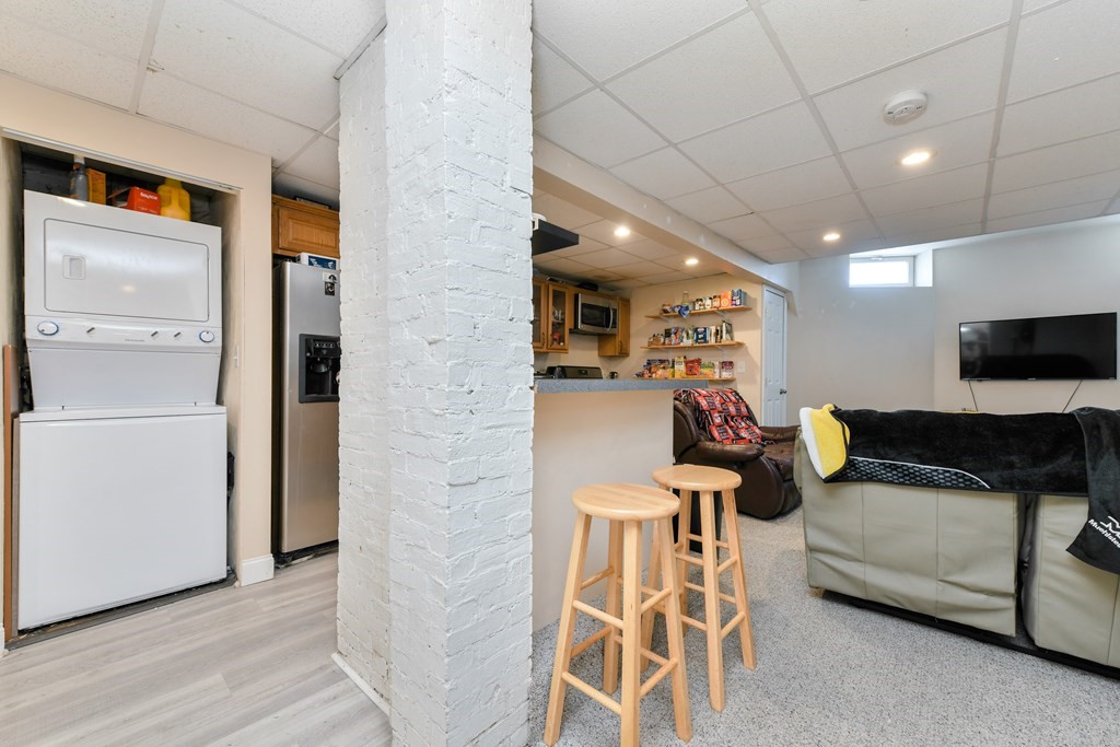 748 East 3rd Street, Unit A Boston, MA 02127 - Photo 11 of 16 a living room with furniture and a flat screen tv