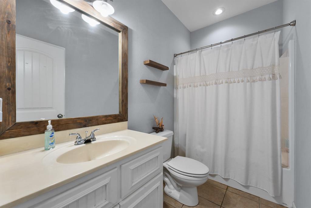 155 Rs County Road Emory, TX 75440 - Photo 16 of 31 a bathroom with a sink toilet and shower