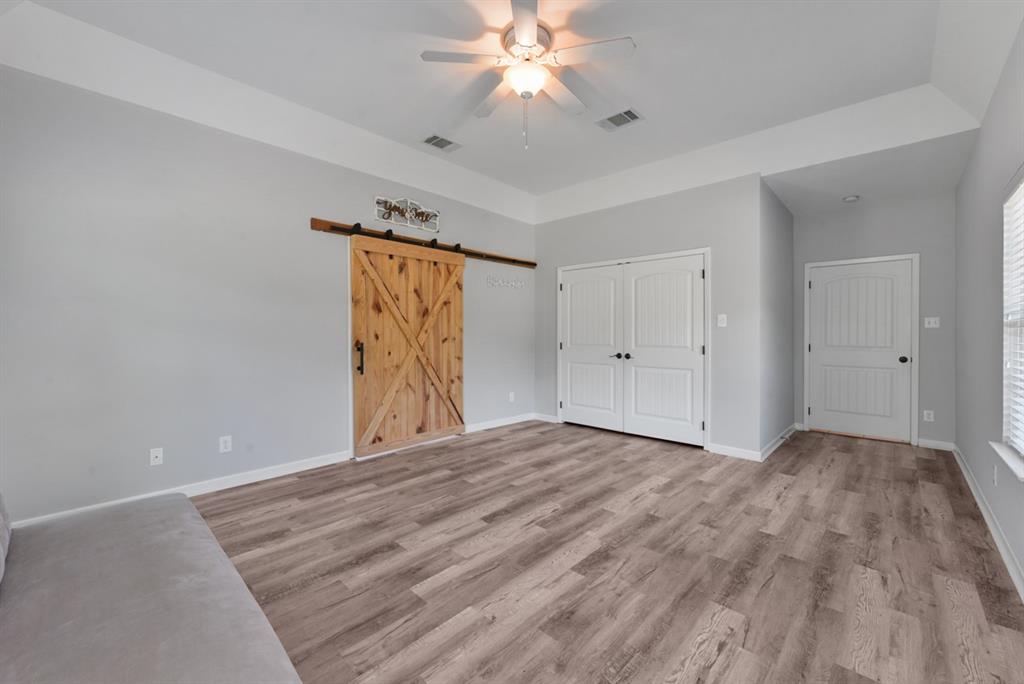 155 Rs County Road Emory, TX 75440 - Photo 19 of 31 a view of an empty room with window and chandelier fan