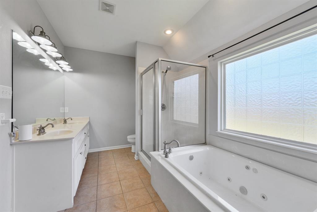 155 Rs County Road Emory, TX 75440 - Photo 20 of 31 a bathroom with a tub sink and mirror
