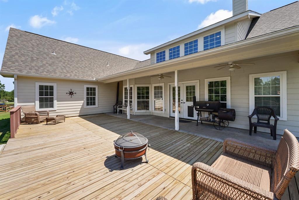 155 Rs County Road Emory, TX 75440 - Photo 22 of 31 a outdoor space with patio the couches and a dining table and chairs with wooden floor