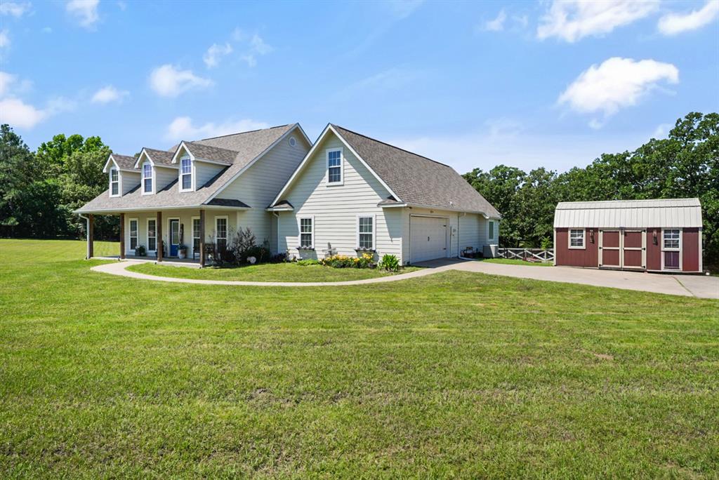 155 Rs County Road Emory, TX 75440 - Photo 30 of 31 a front view of a house with garden