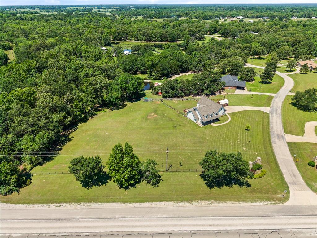 155 Rs County Road Emory, TX 75440 - Photo 4 of 31 an aerial view of a house with yard swimming pool and outdoor seating