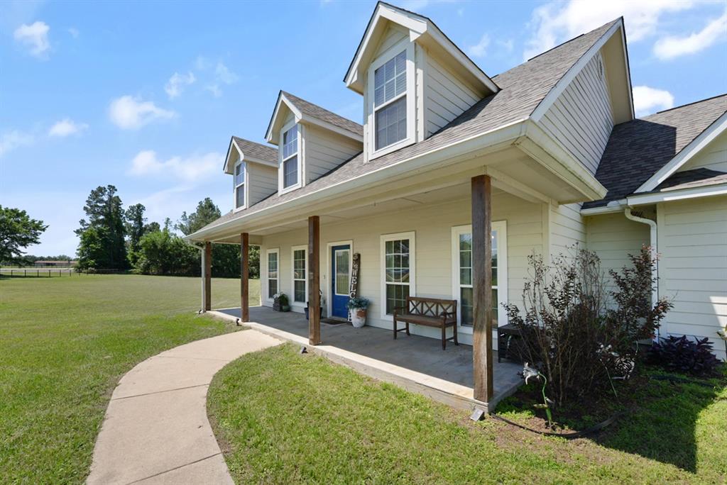 155 Rs County Road Emory, TX 75440 - Photo 5 of 31 a view of a house with backyard porch and garden