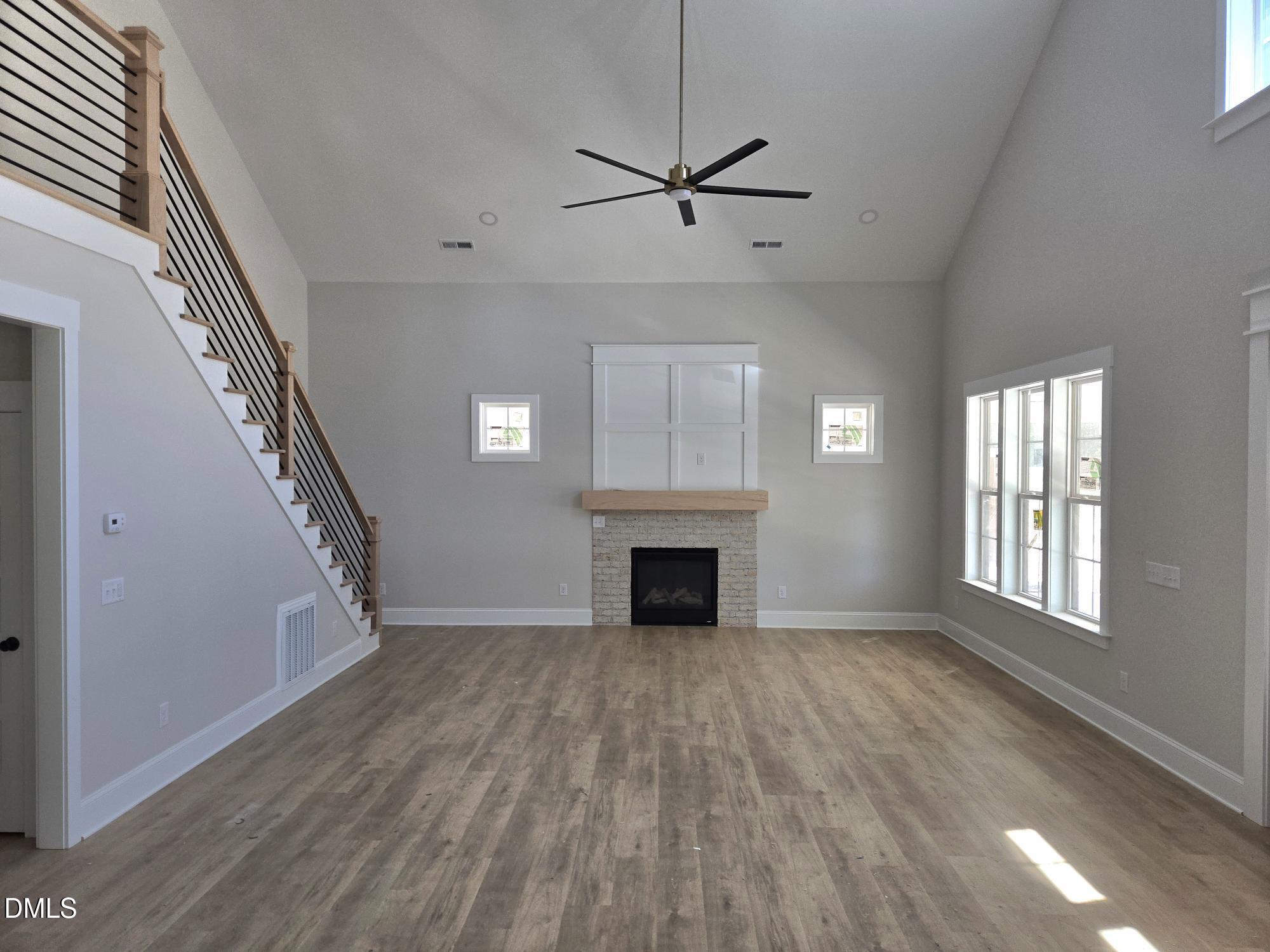 300 Avery Road Erwin, NC 28339 - Photo 5 of 38 a view of an empty room with a fireplace and a window