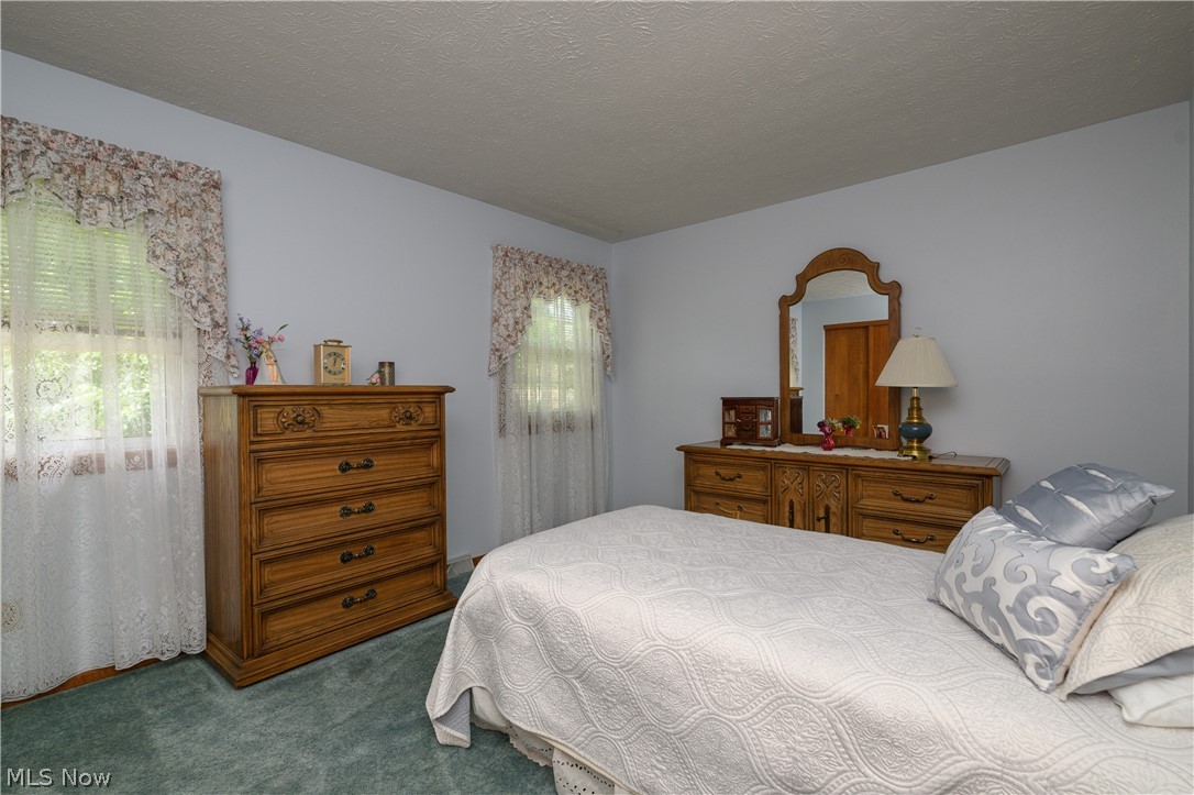 3281 Brenner Road Barberton, OH 44203 - Photo 24 of 33 Bedroom featuring carpet floors and a textured ceiling
