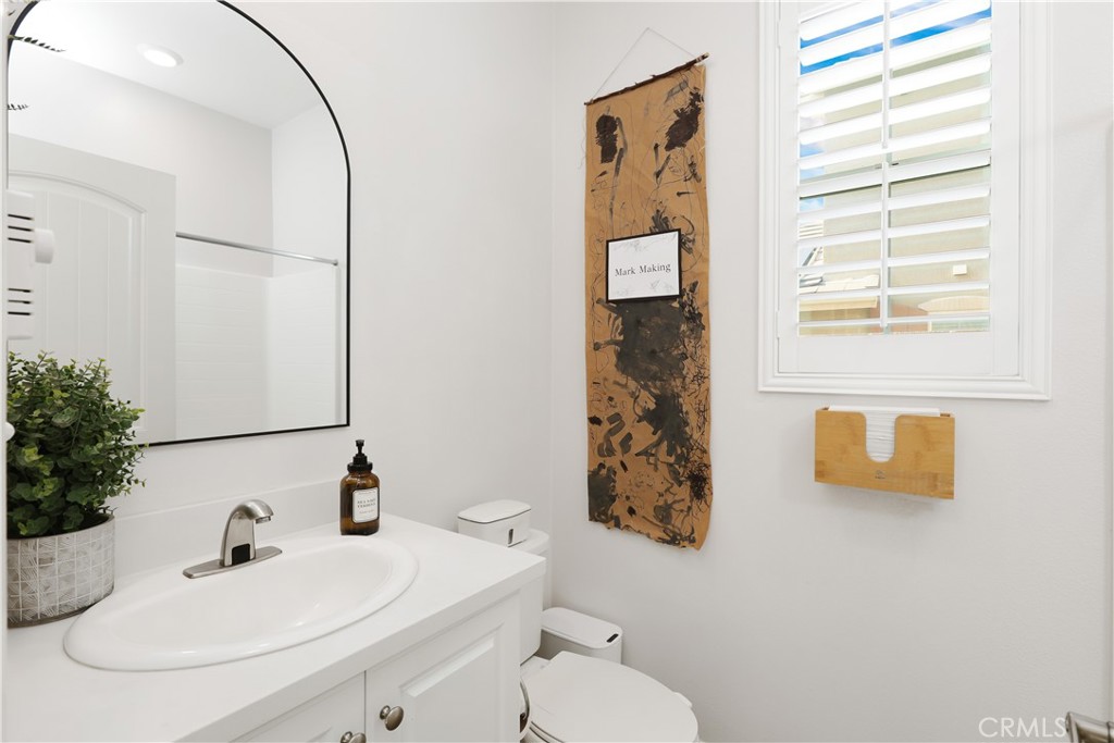 13170 Winslow Drive Rancho Cucamonga, CA 91739 - Photo 19 of 57 a bathroom with a sink a toilet and mirror