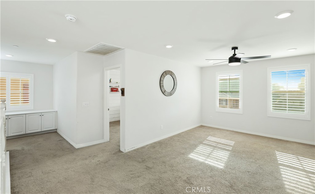 13170 Winslow Drive Rancho Cucamonga, CA 91739 - Photo 24 of 57 an empty room with windows and ceiling fan