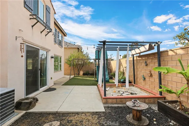 a view of a patio with a table and chairs
