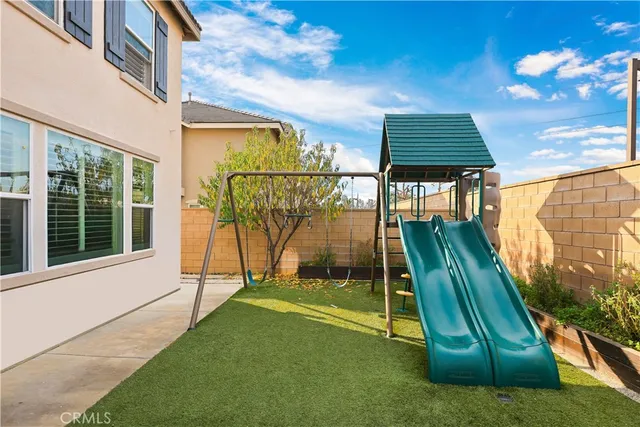 a view of a terrace with chairs and potted plants